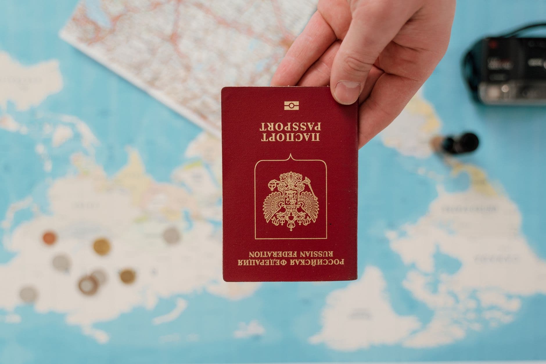 World map with travel documents on a desk